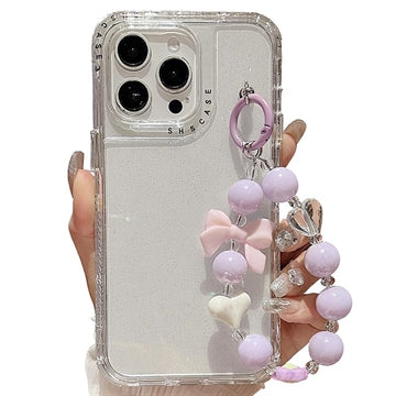 iPhone 16 Pro Glitter stødsikkert hybrid cover med håndledsrem - gennemsigtig
