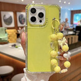 iPhone 16 Pro Max Glitter stødsikkert hybrid cover med håndledsrem - gul