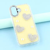 iPhone 16 Funklende Kærlighed og Perle Hybrid Cover - Gul