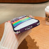iPhone 17 Pro Regnbue Kviksand Hybrid Cover med Rhinestone-kameradekor - Lilla